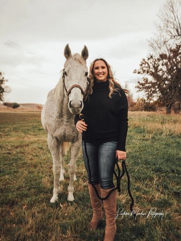Dr. Melanie Garbel with her horse, Penny.