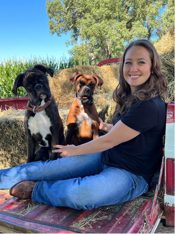Dr. Jackie Martin with her two Boxers, Elmer and Elna.