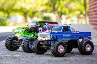 Two RC trucks in blue and green color