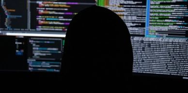 Linux Engineer using multiple screens and terminals.