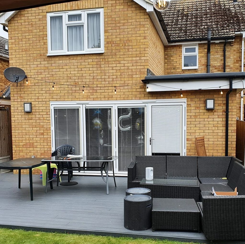 Two storey extension to end of terrace house with composite decking and bi-fold doors.
