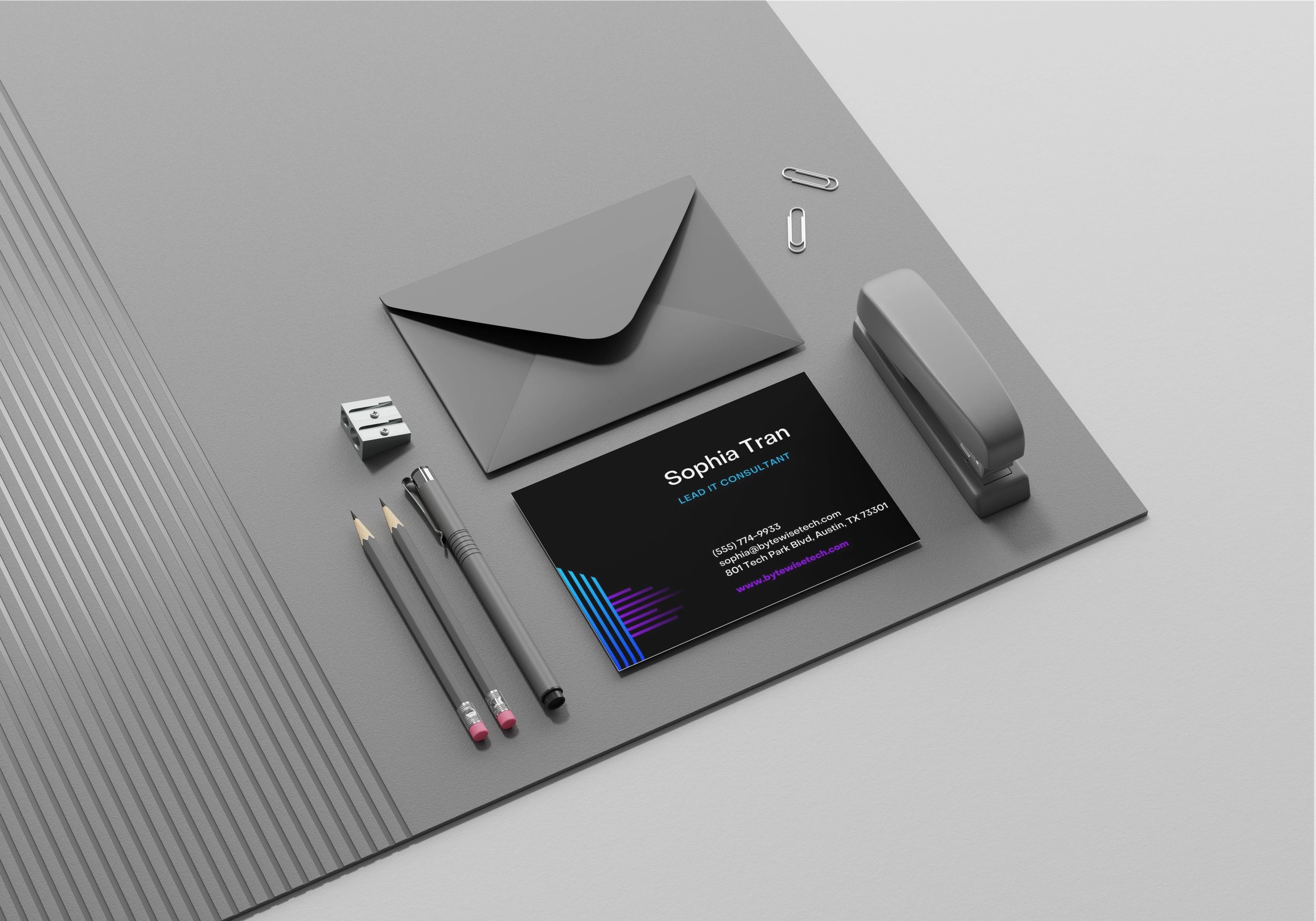 Modern gray office supplies with a black and blue business card for Sophia Tran, IT consultant.