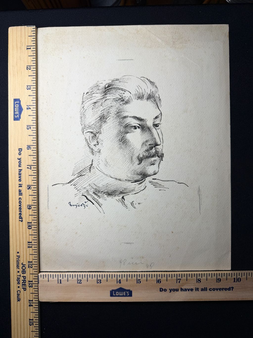 Pencil sketch of a man with a mustache and combed-back hair, framed by rulers.