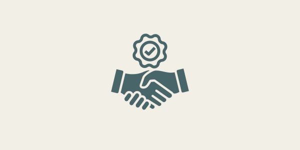 Handshake with a checkmark seal icon.