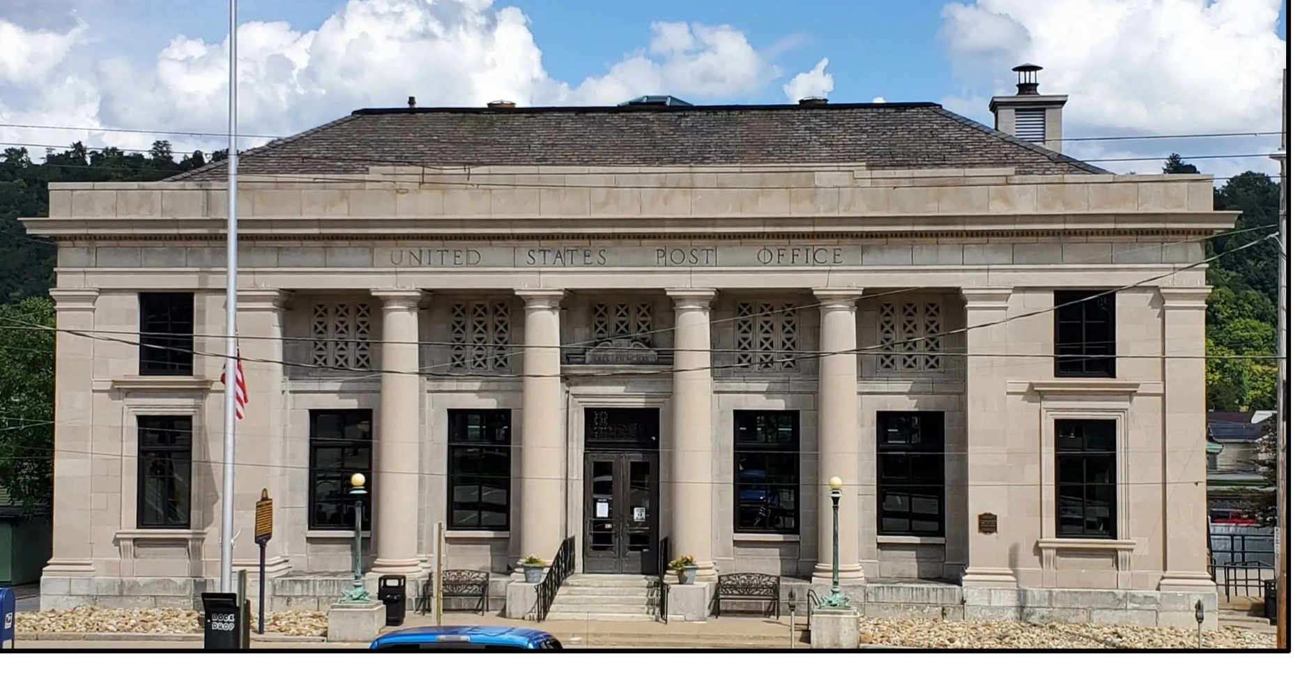 Historic United States Post Office building with classical columns and stone facade.