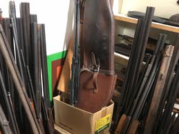 Piles of guns in one corner
