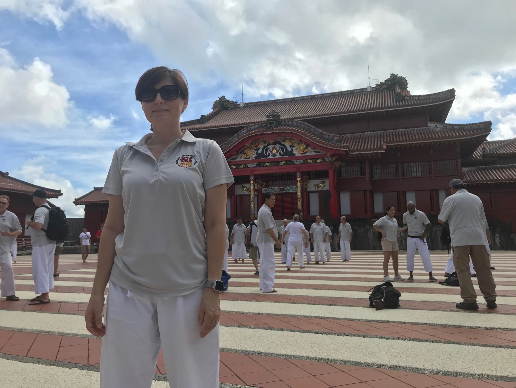 Denise, head instructor, stands in front of Shruri Castle in Okinawa Japan.