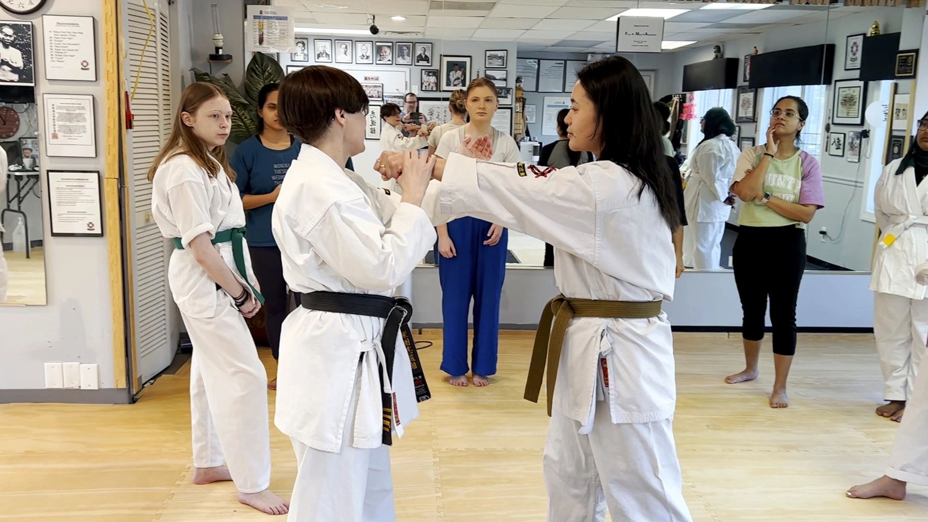 Martial arts class practicing self-defense techniques.