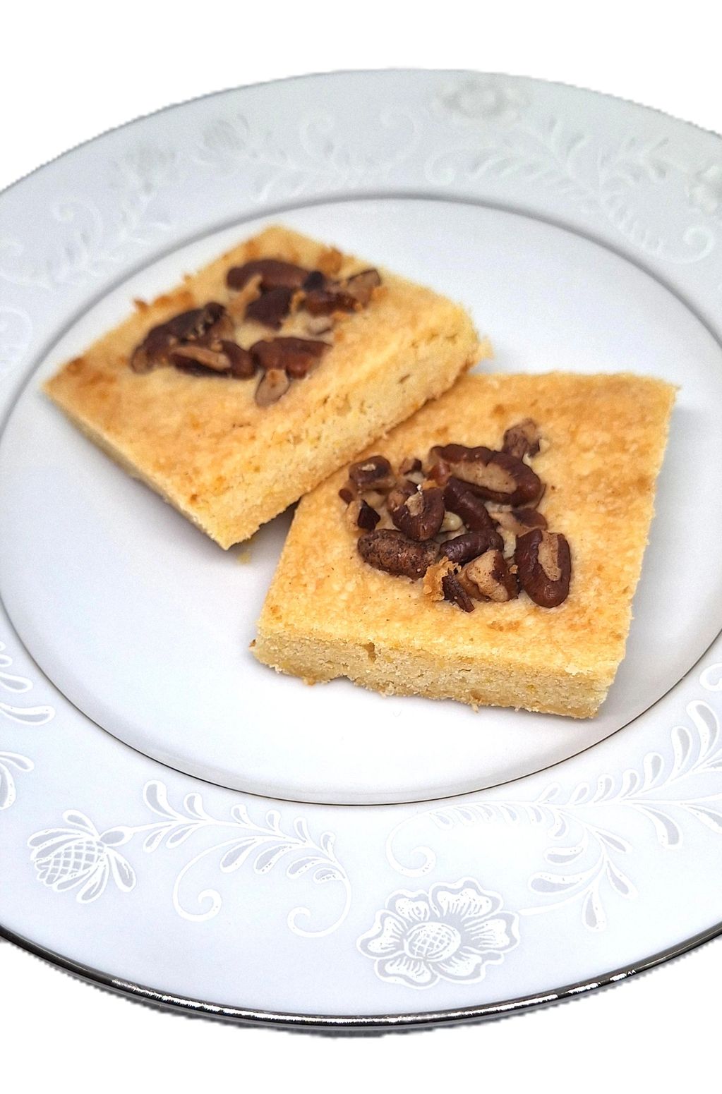 Lemon Pecan Shortbread Squares on  plate.