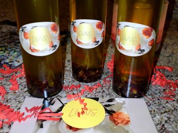 The Honeysuckle Rose Body Oil includes dried rose petals  that continuously regenerate as you shake 