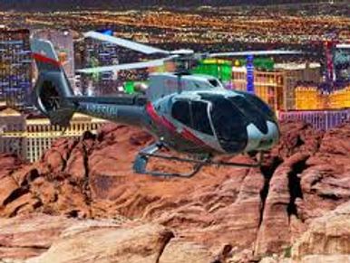 Maverick Helicopter flying over Las Vegas skyline