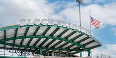 Entrance to Block Stadium with American flag flying.