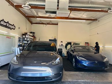 window tinting tesla specialists installing ceramic film onto all makes and models of Elon Musks car