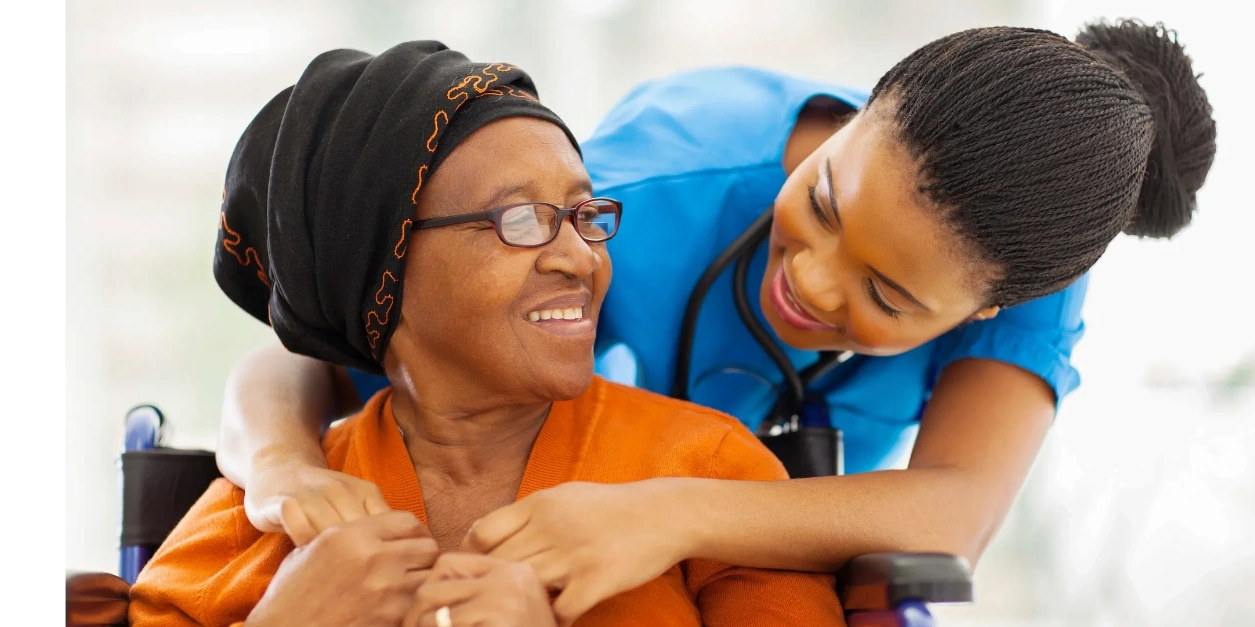 Home health aide assisting an elderly patient with daily care and support at home in New York