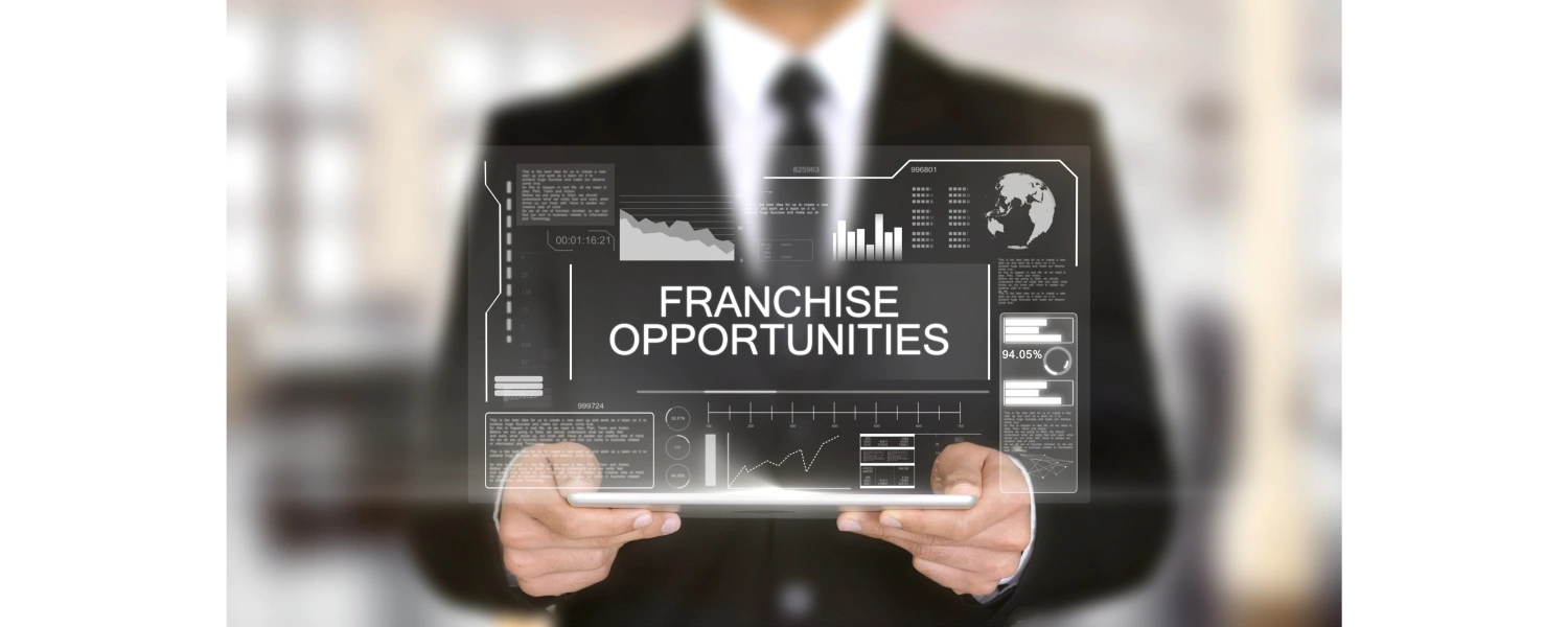 Man in a suit holding a screen projecting graphs representing franchise opportunities and outcomes 