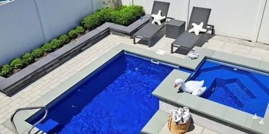 Outdoor pool and hot tub. Inground pool and hot tub. Outdoor fiberglass pool and hot tub installed.