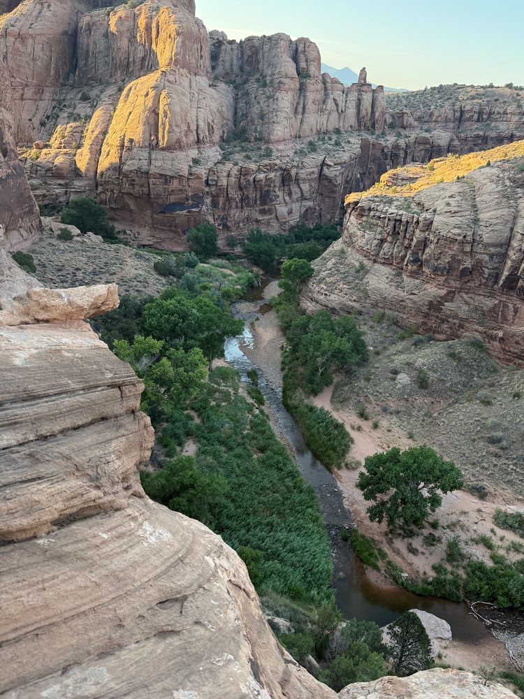 Photo of Millcreek canyon near Moab Utah, rock formations that are a sandy tan with a waterfall