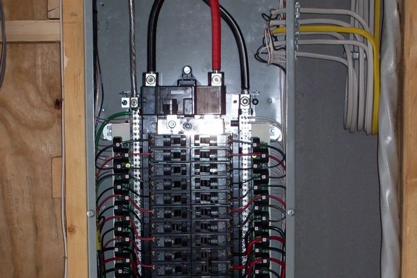 Siemens electrical breaker box interior with wires and circuit breakers