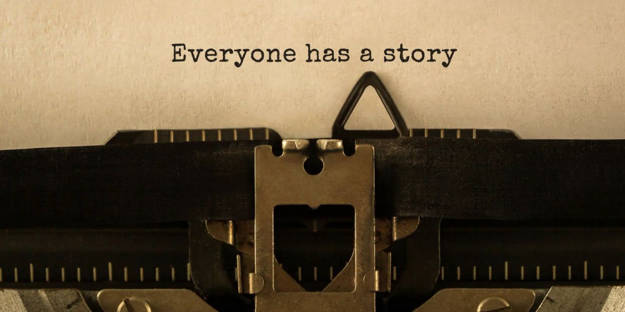 Typewriter typing the phrase 'Everyone has a story'.