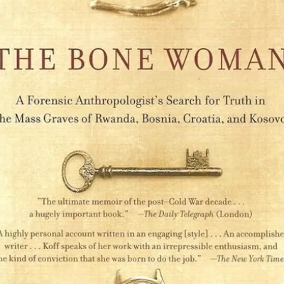 Cover of The Bone Woman by Clea Koff published by Random House showing a small bone and antique key