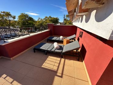 Sunbathing on roof terrace, Casa Lulu