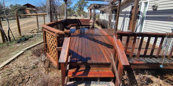 A revived redwood deck with a built-in seating area.