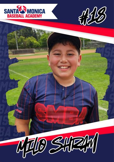 Young baseball player Milo Shram smiling on the field in Santa Monica Baseball Academy uniform.