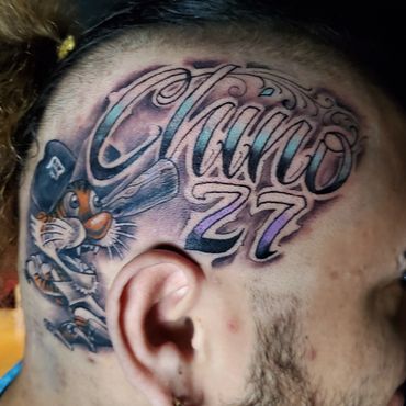 Chino 27 freehand lettering on the side of clients head. With paws from the Detroit Tigers.