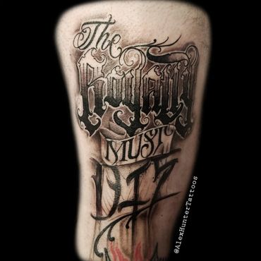 The Royalty must die. Custom lettering, mixed script style on thigh.