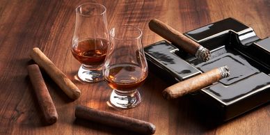 Whiskey and cigars on a fine wooden surface
