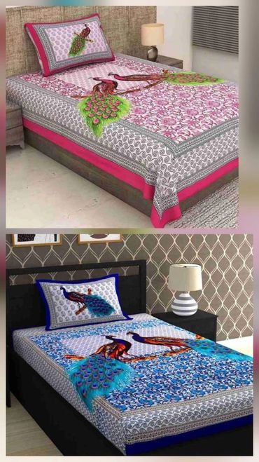 Two beds with vibrant peacock-themed bedding sets.