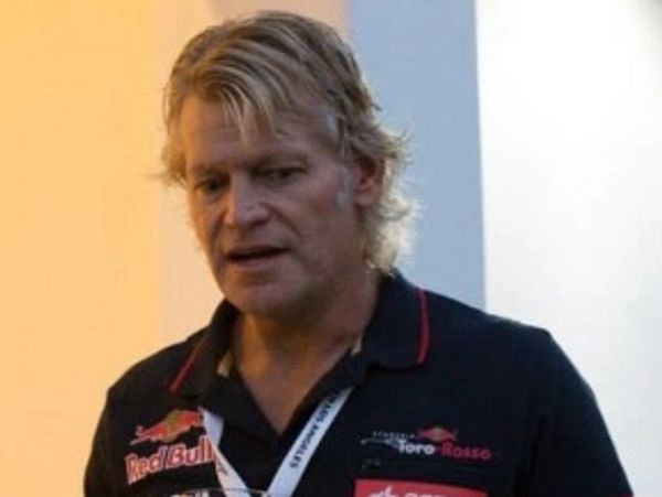 An exceptionally good looking man in a Red Bull race shirt 