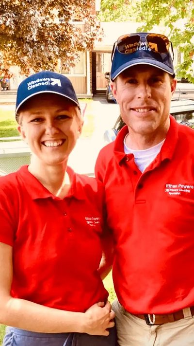 Picture of husband and wife window cleaning team.