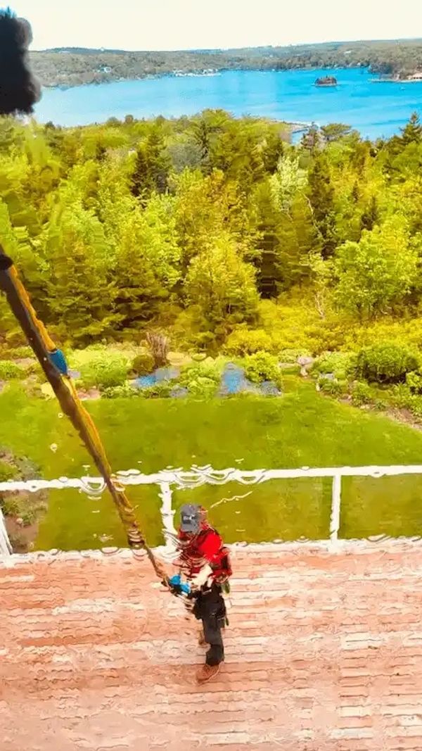 image of window cleaner cleaning windows on a residential home in Halifax.