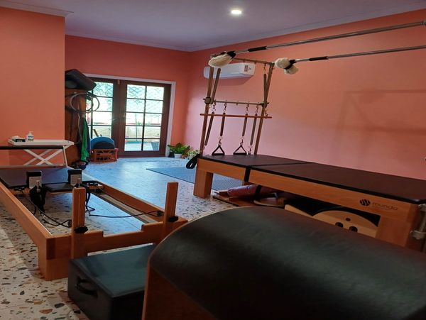A room fully equipped with pilates equipment