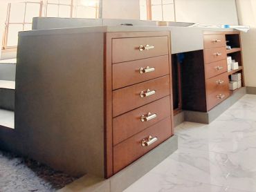 Wooden drawers and shelves in an office or study room.