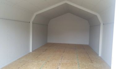 Empty white room with wooden floor.