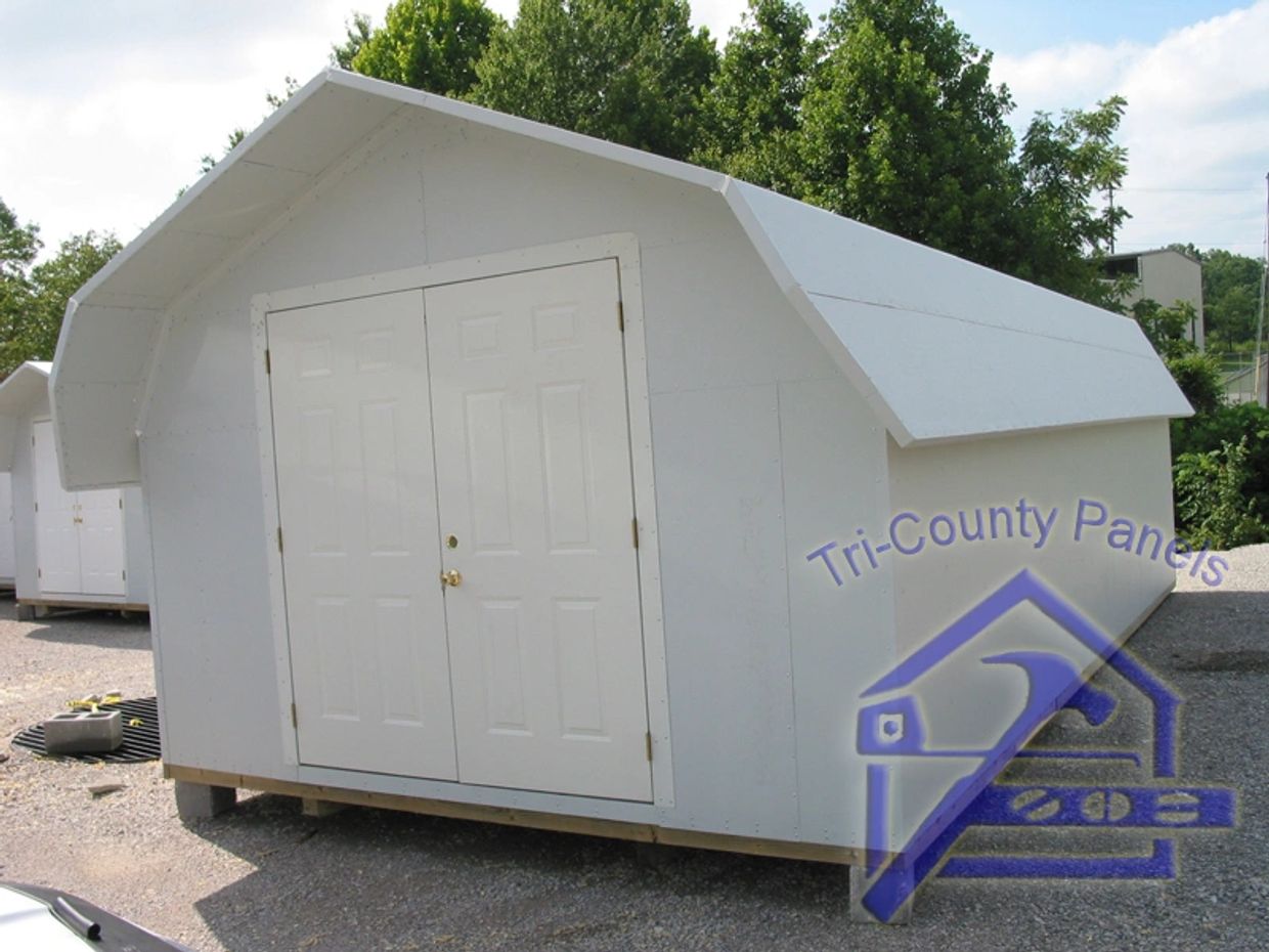 White outdoor storage shed with double doors.