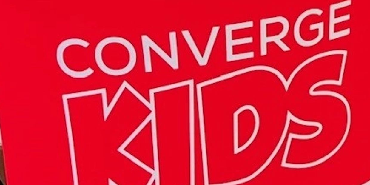 Converge Kids Check-in station and Welcome banner.