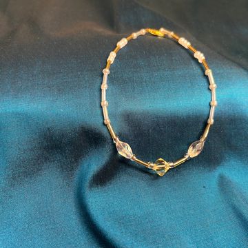 Vega star anklet on a blue background