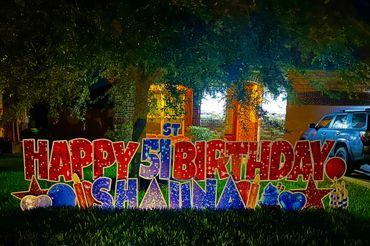 Colorful outdoor sign celebrating a 51st birthday for Nishan.