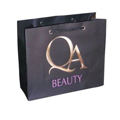 Matte black paper bag featuring embossed gold foiling logo – elegant custom packaging