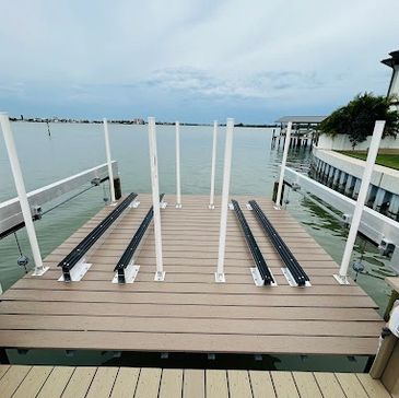 Empty dock with water and sky in the background.