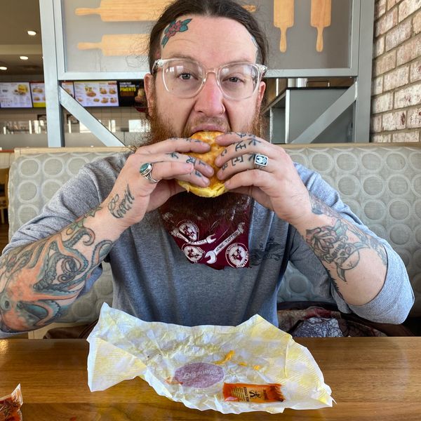Image of Josh Cecil the professional  tattoo artist in Burlington, NC eating at Bojangles.