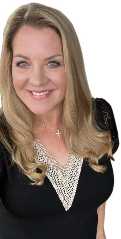 Smiling woman with blonde hair and blue eyes wearing a black top with lace detail.