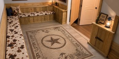 Custom western-themed kids room with built-in seating, storage, woodwork, and LVP flooring.