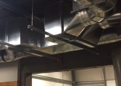 A BPE energy recovery ventilator (ERV) hooked up to duct work to improve indoor air quality.