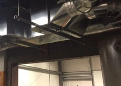 A BPE energy recovery ventilator (ERV) hooked up to duct work to improve indoor air quality.