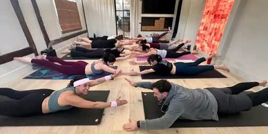 Students participate in a hot yoga class with the clean indoor air quality provided by a BPE ERV.