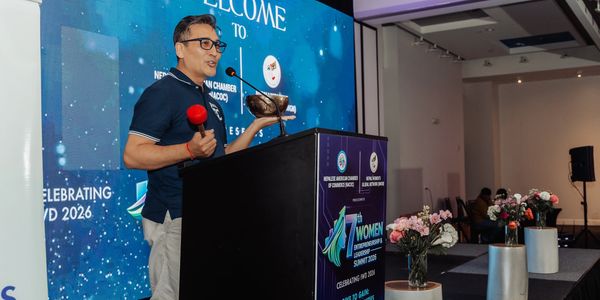 Man speaking at a women's leadership summit.